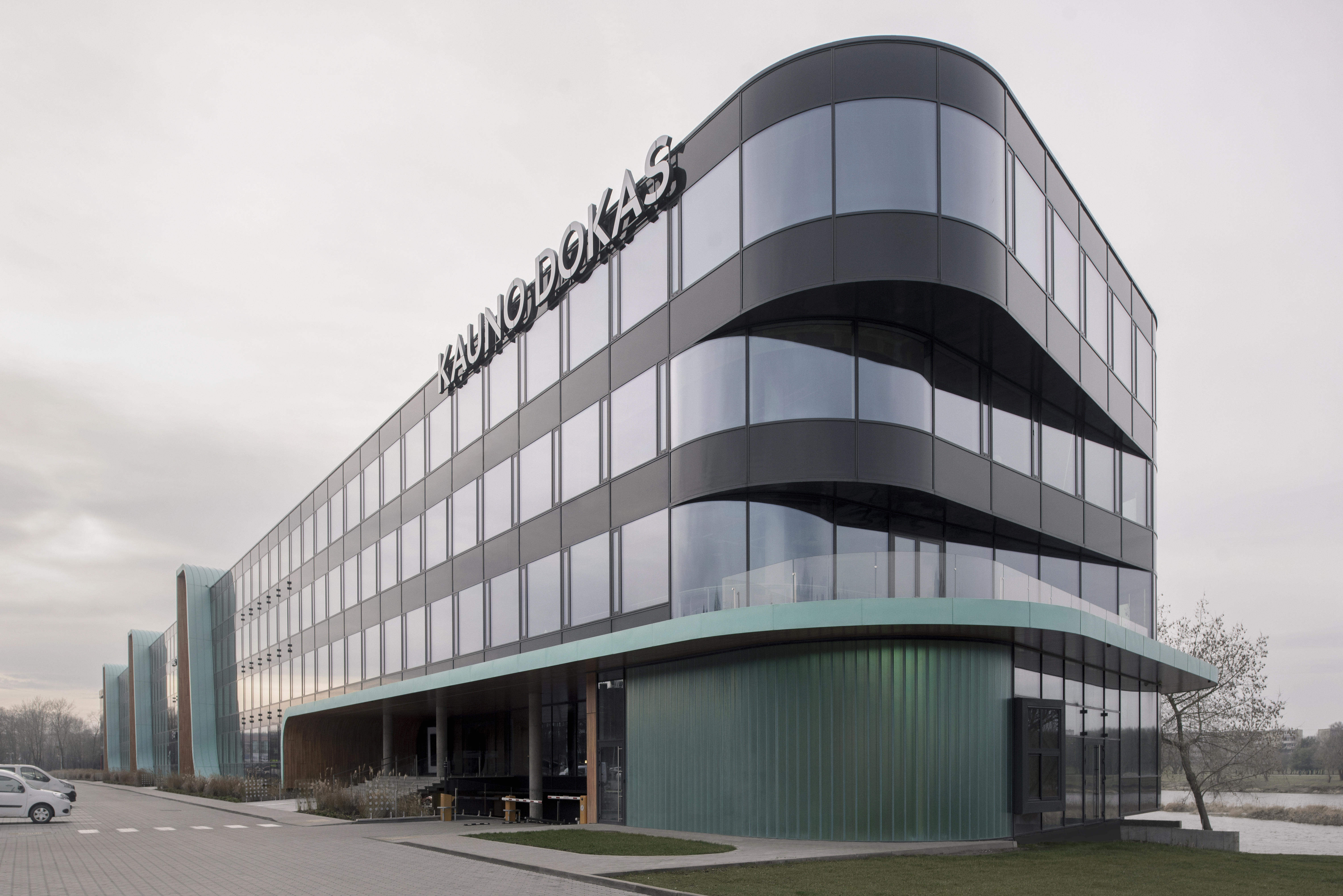 KAUNO DOKAS – Eco-friendly business center using unitized glass facades